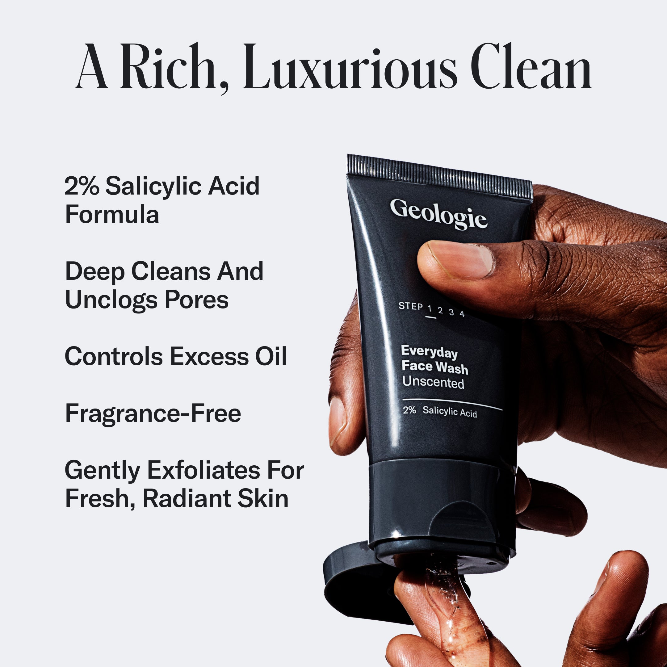 Hand squeezing Geologie salicylic acid face wash from the Geologie Skincare Sample Set onto another hand, with text highlighting product features including 2% salicylic acid, pore cleansing, oil control, unscented, and gentle exfoliation for radiant skin. Ideal for those who appreciate effective skincare products.